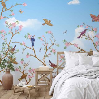 papel tapiz floral con ramas marrón y flores rosas aves volando con cielo azul del dia creado por adazio design.